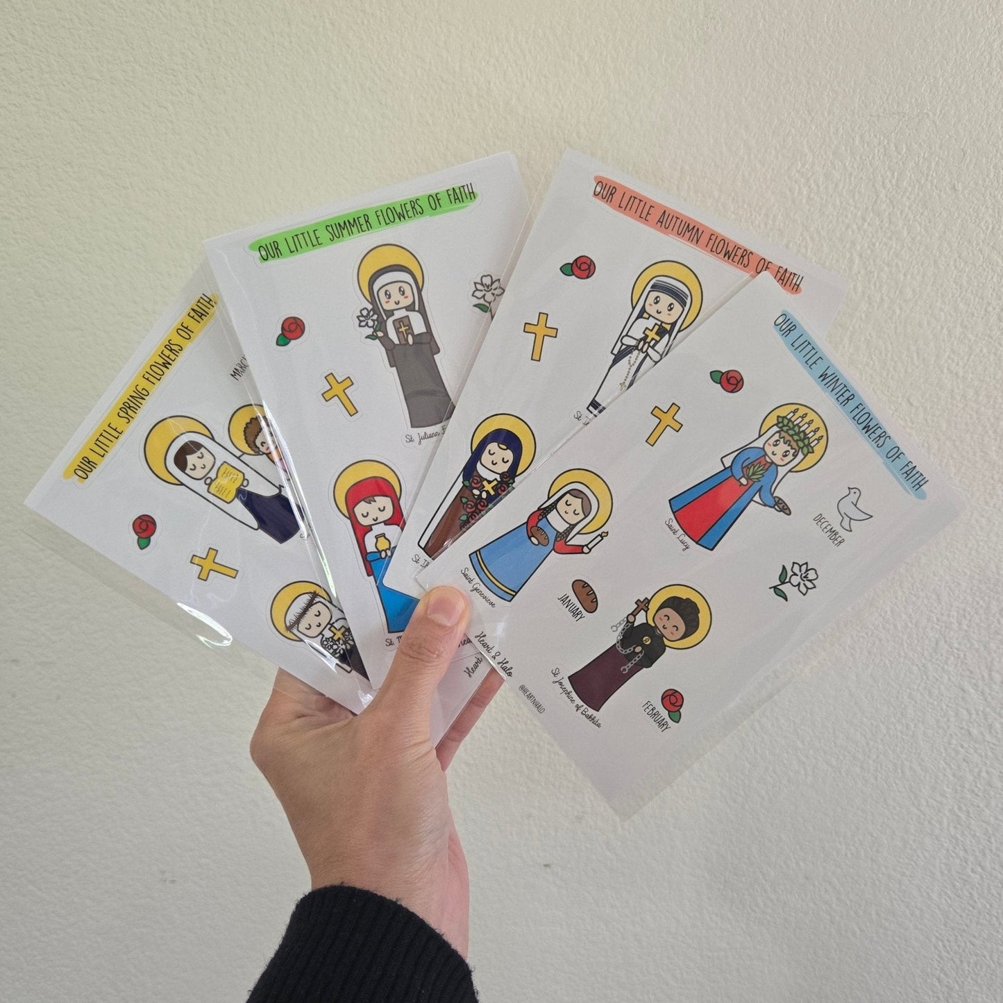 Our Little Winter Flowers of Faith 4" x 6" Sticker sheet, St. Lucy, St. Genevieve, and St. Josephine of Bakhita, Catholic Saints - Heart & Halo