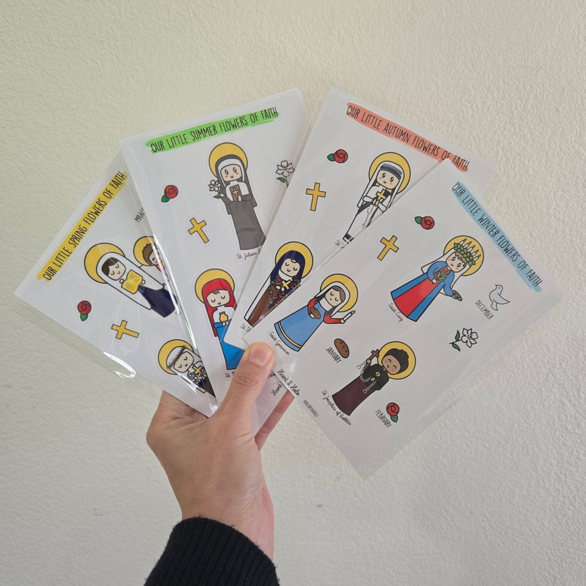 Our Little Winter Flowers of Faith 4" x 6" Sticker sheet, St. Lucy, St. Genevieve, and St. Josephine of Bakhita, Catholic Saints - Heart & Halo